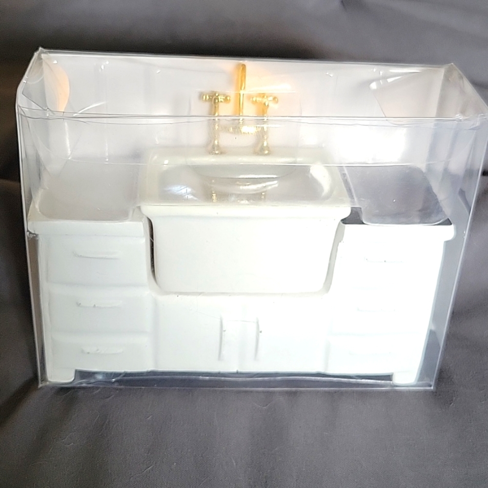 Miniature sink for dollhouses and tiny homes.